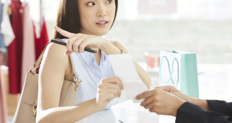 Girl Holding Receipt Paper